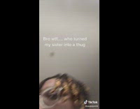 Girl in black shirt in bathroom singing rapping