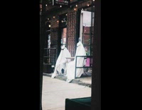 2 people in ghost costumes pose at cafe 
