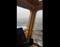 Waves seen on the window of boat