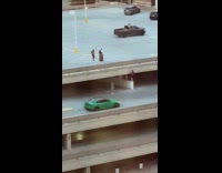 Couple on the parking lot with two men below photoshoot Part 2