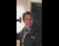 Guy opens second coors light beer and it sprays all over him and  sink restroom