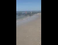 Woman hat dress slip on rock beach