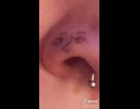 Girl makes face drawn on nose sing 