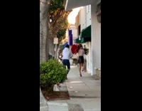 woman holds large rose bouquet
