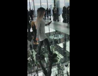 Blonde woman hair whip sit glass room
