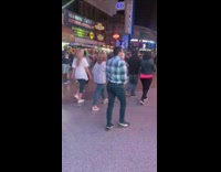 Lady in All Black Poses for Photos in Nightlife