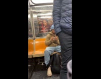 Man brown jacket clip nails in train