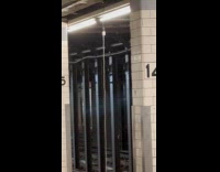 Phone hanging at subway ceiling while charging