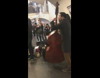 orchestra playing in subway station