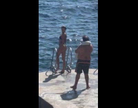 Woman bikini poses photoshoot by old man