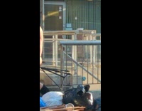 Woman walks wear sexy black attire along the street 