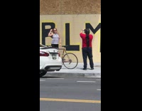Girl raise fist protest wall paint BLM
