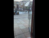 White sweater girl poses ice skating rink 