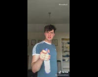 Guy dances with blue febreze spray