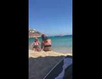 Woman white bikini sand toss photo shoot