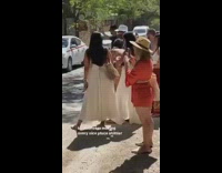 Tourists line up for statue picture