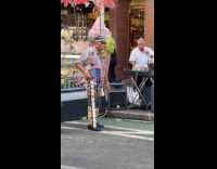 Collab WINY - Man dances to music San Gennaro feast
