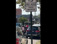 Guy rides car open trunk pulls cart