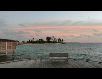 Sunset sky in beach wooden bridge boats