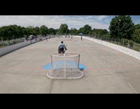 Man sandwiched playing hockey