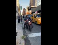 Man Captain America costume rides the motorcycle