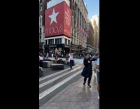 Woman dances in middle of the street