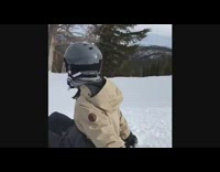 Guy brown jacket jumps off ramp on snowboard and crashes into snow, jackass 2