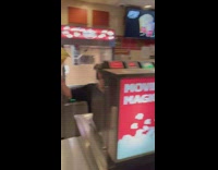 Girl throws entire bag of popcorn at customer 