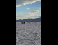 Five people dance outside in death valley 