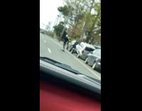 Guy Carries Baby While Skateboarding 