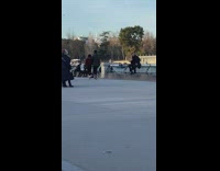 Man black clothes Kermit green frog costume