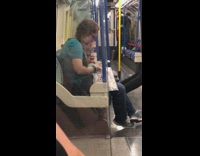 woman in blue with glasses eating boogers 