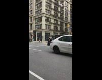 Lady posing for photos blocks traffic crosswalk 