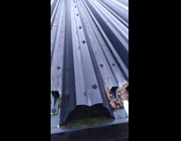 Person taps metal roof sounds like laser