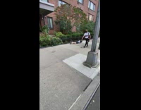 Man do push ups along the street at day