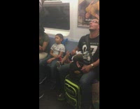 man and boys fall asleep on train