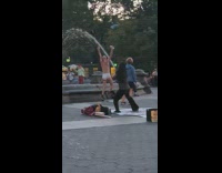 Man in underwear dances around fountain