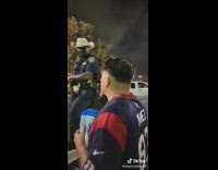 Guy pets police officers leg on horse 