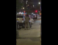 Guy humps bike rack at night 