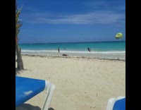 Shirtless Guy Does Push Ups at Beach