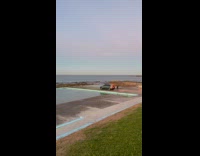 Car drove at ocean pool for video