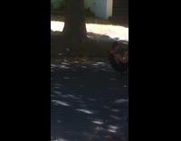 Guy sits on skateboard to film skateboarder