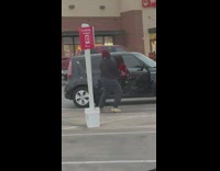 Woman large red bonnet dance parking lot