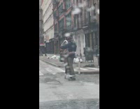 Youtube couple rides electric skateboard while hugging 