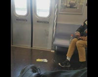 Woman listens to music and rolls blunt on metro train and gets appreciated by guy