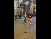 Two people dance tiktok army print street