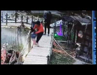 Mom and kid startled with pneumatic alligator head 