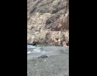 Woman in bikini poses beach forbidden area