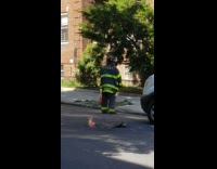 Fire Burns Under Manhole on Street 