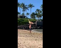 Man shirtless lift woman green bikini fall